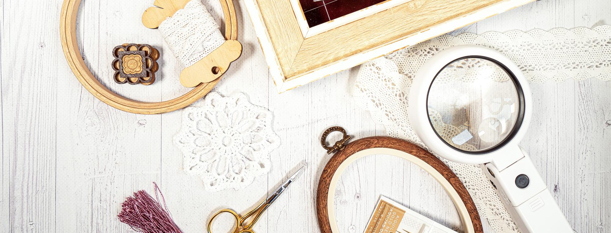 Studio workspace with embroidery tools and threads