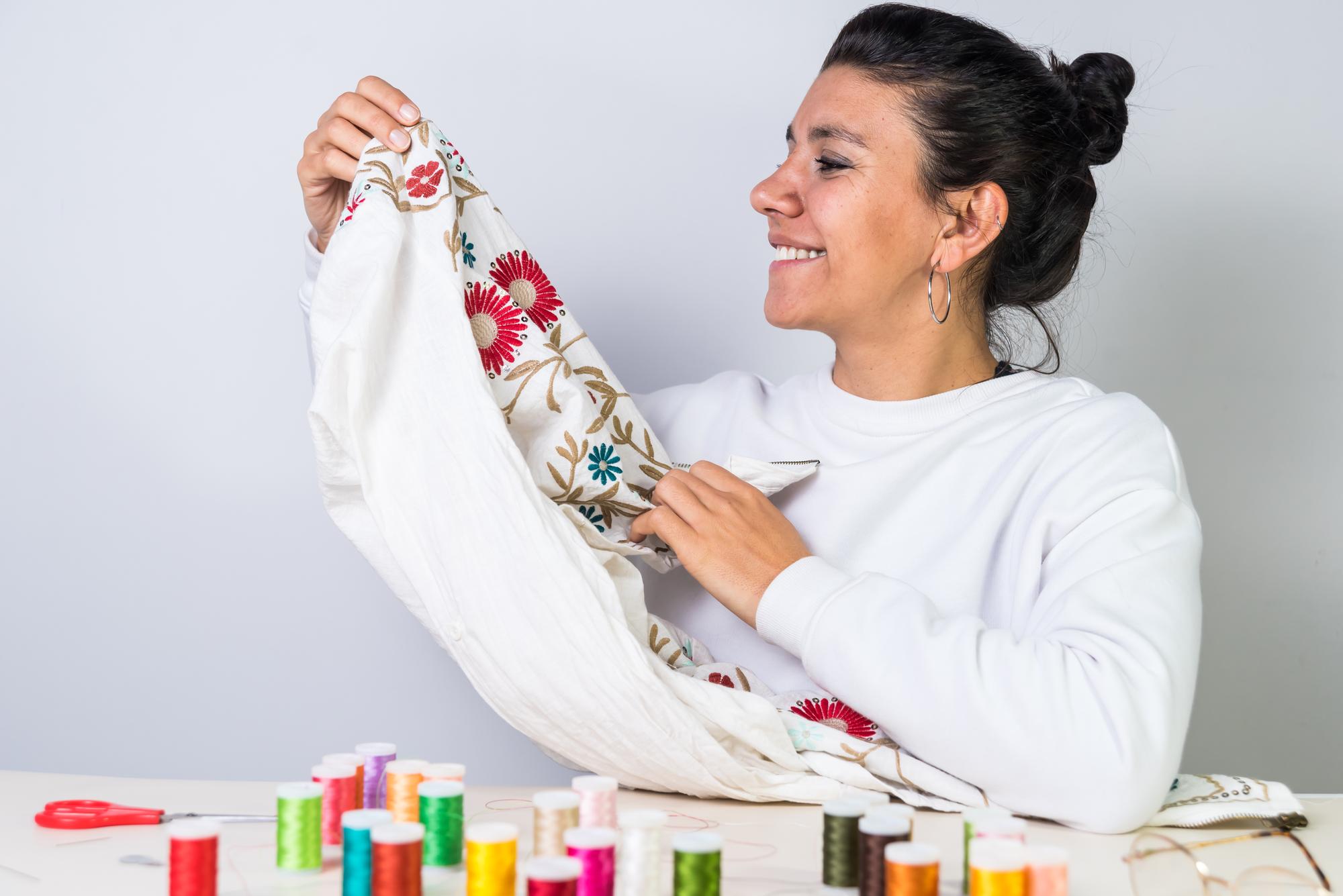 Instructor demonstrating embroidery stitch